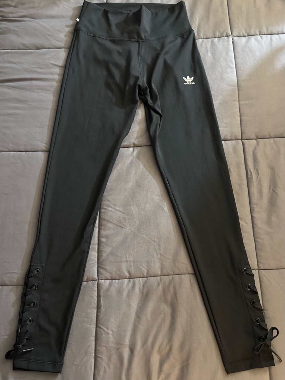 Women Adidas 7/8 black leggings with unique lace-up detail along side of ankle